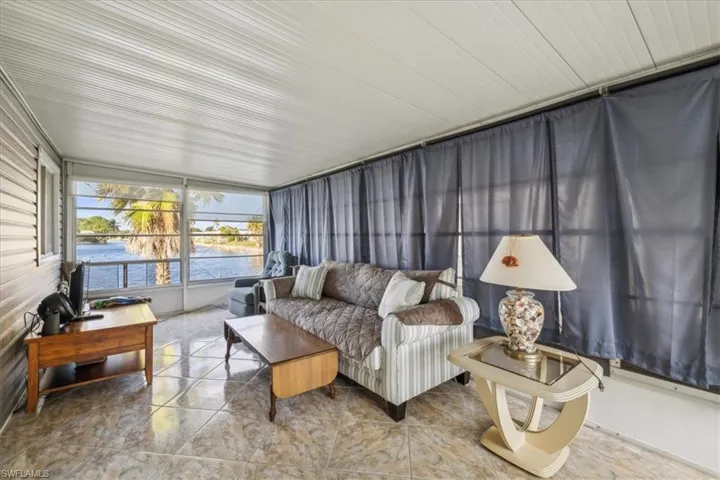 Sunroom featuring outdoor lounge area