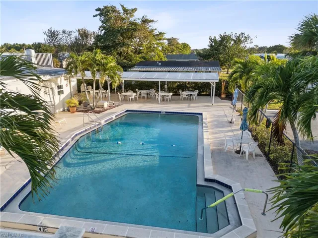 Community pool with a patio area
