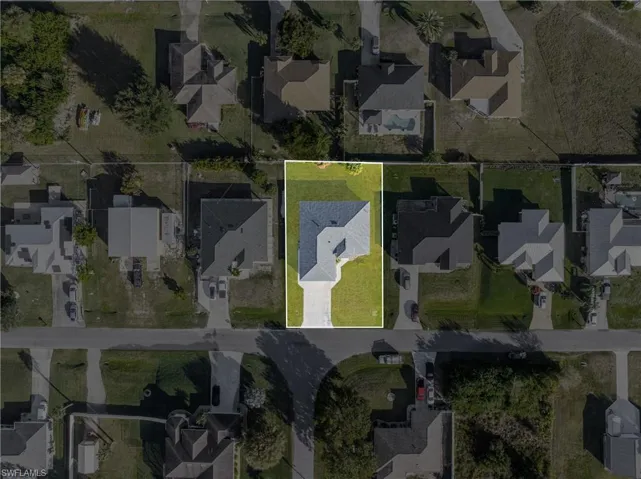 Aerial overview of property's location with nearby suburban area