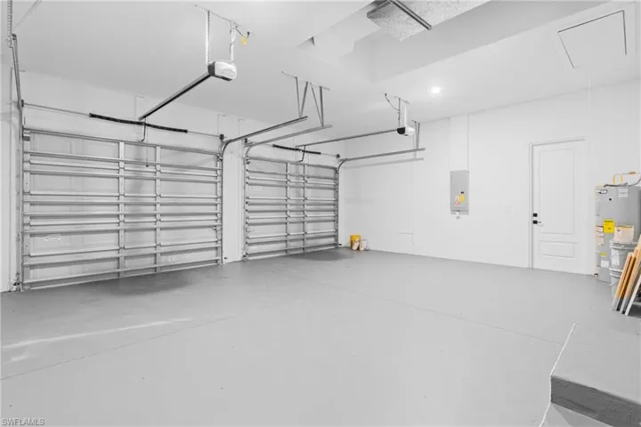 Garage with electric water heater and electric panel