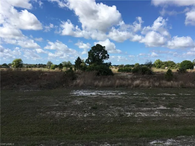 View of yard with a rural view
