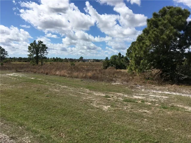 View of yard with a rural view
