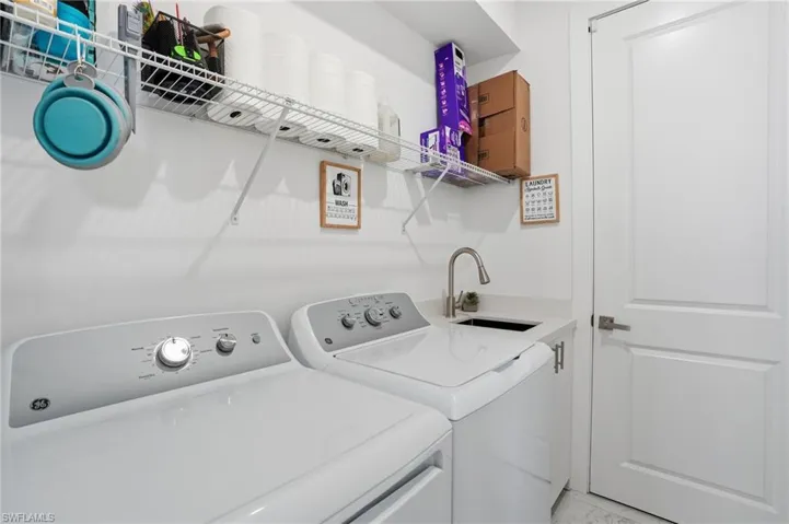 Washroom featuring washing machine and clothes dryer