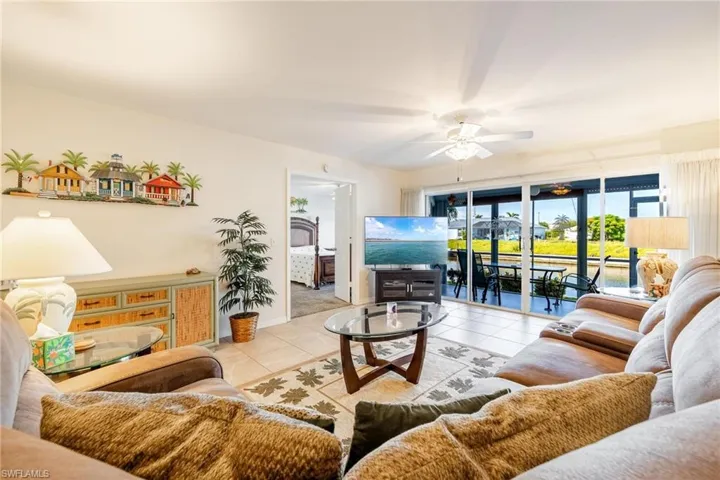 Tiled living room with ceiling fan