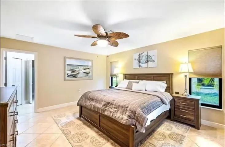 Tiled bedroom with ceiling fan