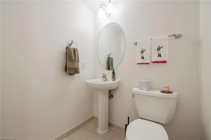 Bathroom with tile patterned floors and toilet