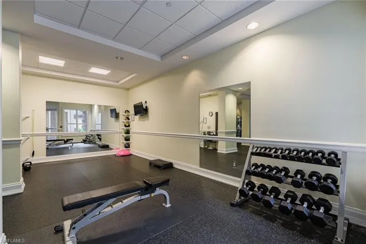 Workout area featuring a drop ceiling