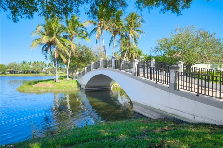 Iconic pedestrian bridges over scenic lakes with lush tropical surroundings throughout IslandWalk.