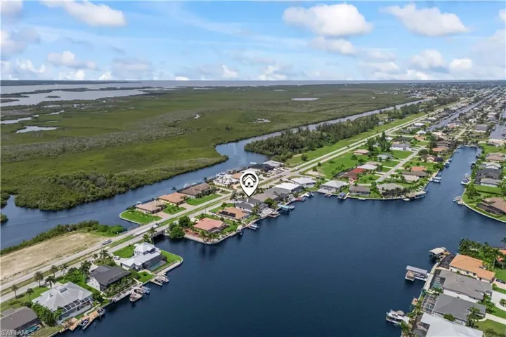 Sweeping aerial view capturing the tranquil waterways and vibrant community nestled along the Gulf.
