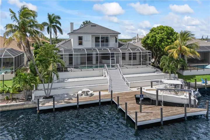Your waterfront playground! Enjoy a private dock, boat lift, and easy access to Matlacha Pass and the Gulf. Watch the dolphins and manatees from your own backyard.