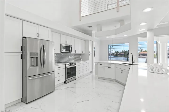This stylish and functional kitchen is a showpiece of the home, delivering high-end finishes with everyday usability.