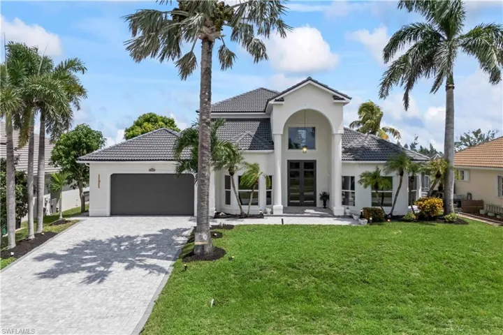 The perfect blend of elegance and Florida charm in this inviting front exterior.