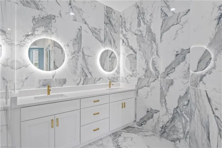 Stylish and serene, this primary bath delivers everyday indulgence with functional elegance.
