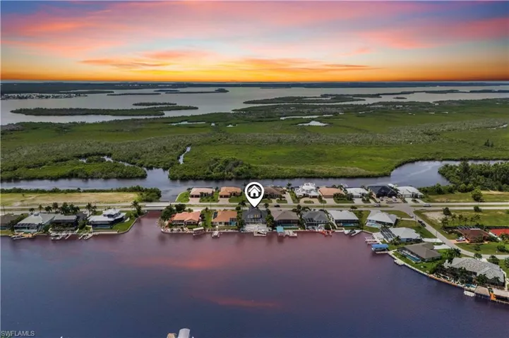 A boater’s dream backyard—private dock, boat lift, and quick Gulf access just steps from your lanai.