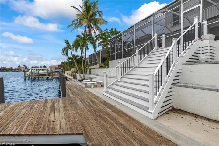 Seamless transition from indoor relaxation to outdoor adventure—steps lead you from the loft straight to the dock.