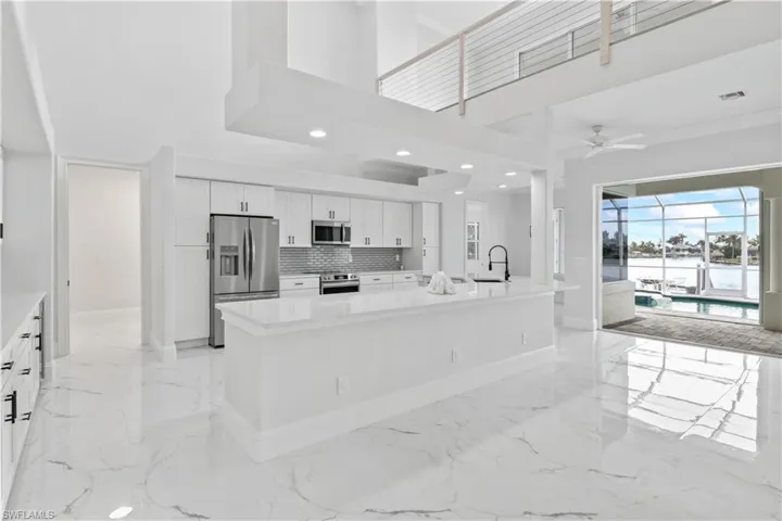 The heart of the home! This chef’s kitchen boasts QUARTZ countertops, brand-new stainless appliances, a wine fridge, pantry, and ample space for cooking and gathering with friends and family.