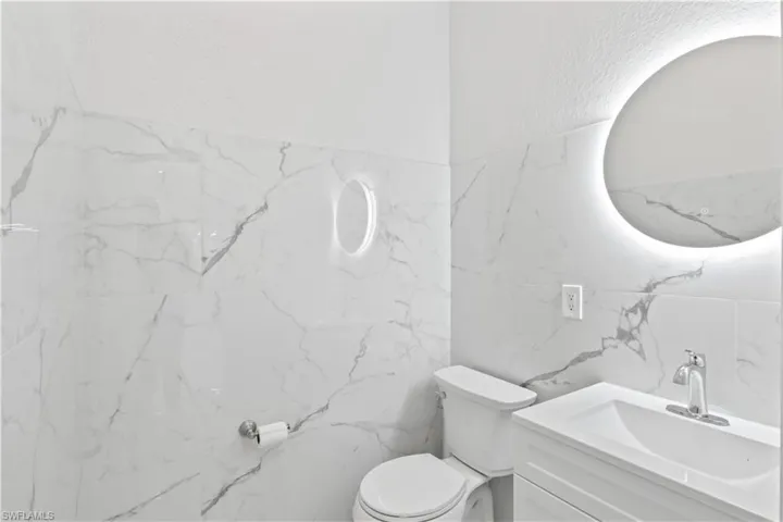 Convenient powder room just off the main living space.