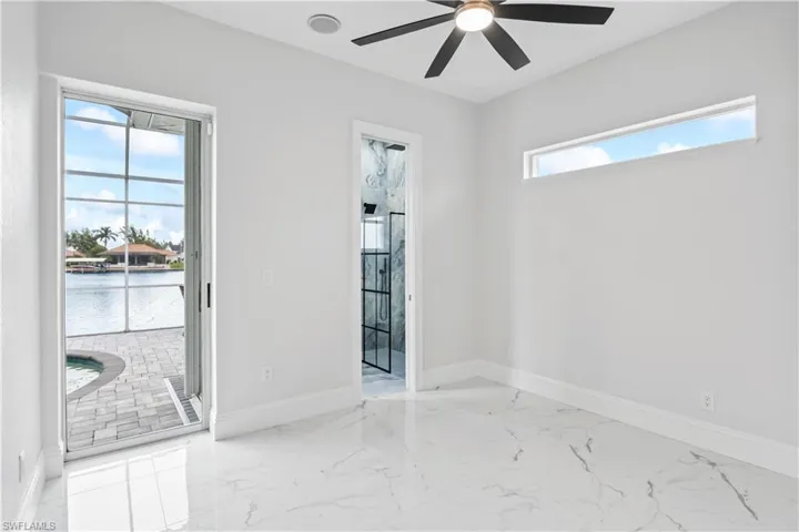 Spacious bedroom with luxurious private ensuite bathroom.
