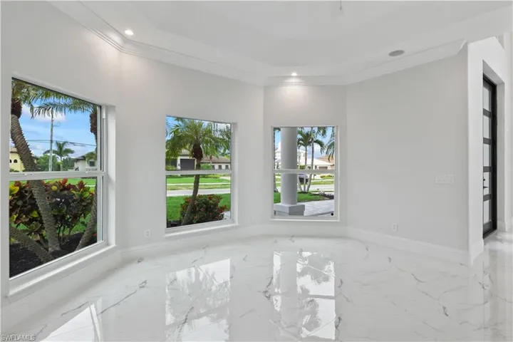 Step into grandeur! The custom entryway hints at the luxury and craftsmanship that define every inch of this home.