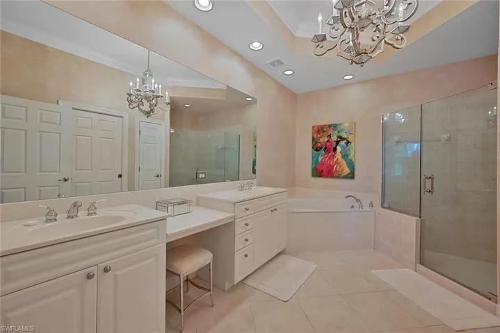 Soaking tub, shower, dual sinks, and vanity