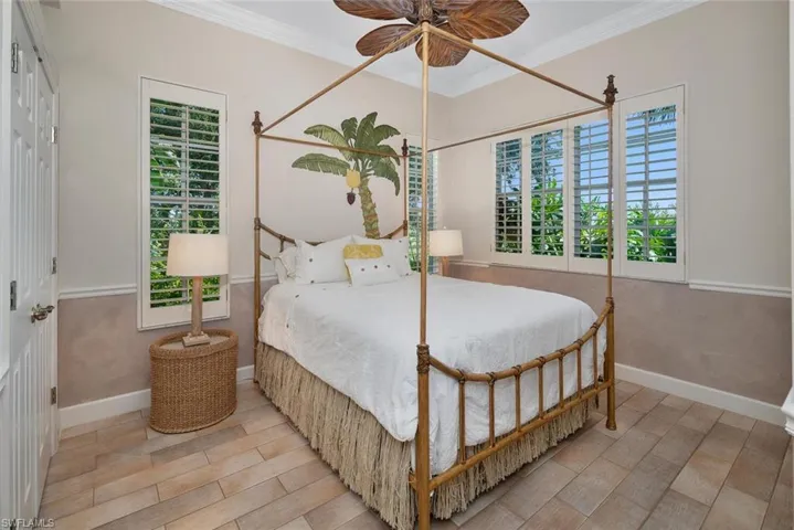 Guest bedroom with painted tropical wall