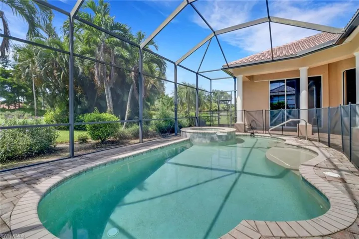 Under cover screened lanai with private swimming pool, spa & view of golf course