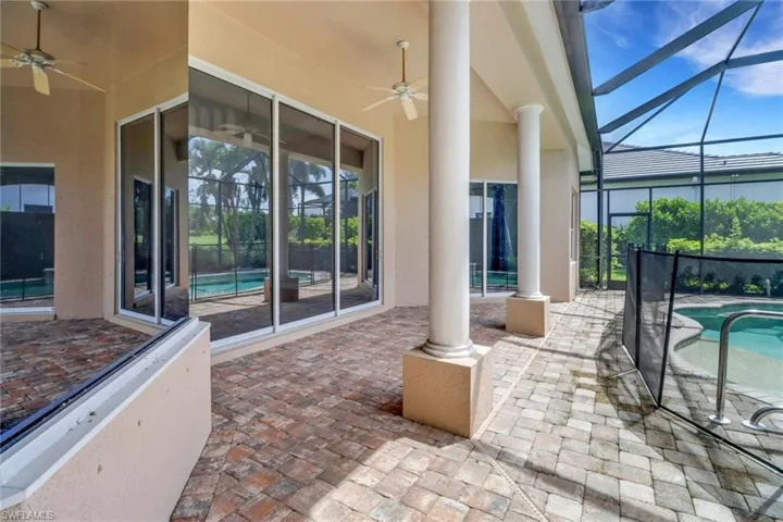 Under cover screened lanai with private swimming pool, spa & view of golf course