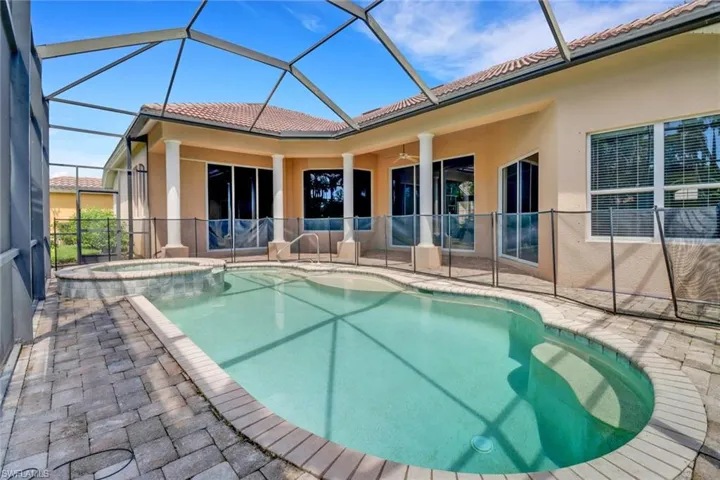 Under cover screened lanai with private swimming pool, spa & view of golf course
