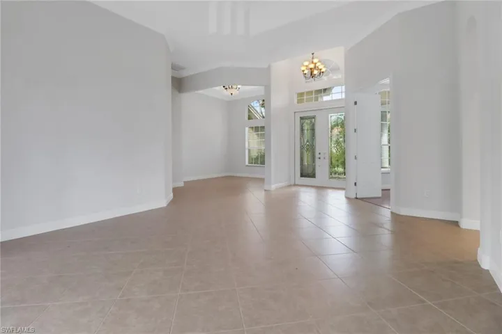 View from living room to front entry & formal dining room