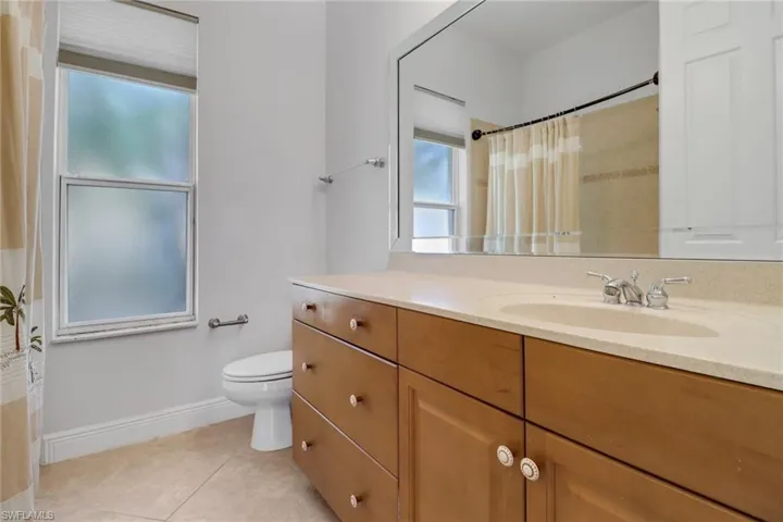 Guest bathroom with tub/shower combination & large vanity