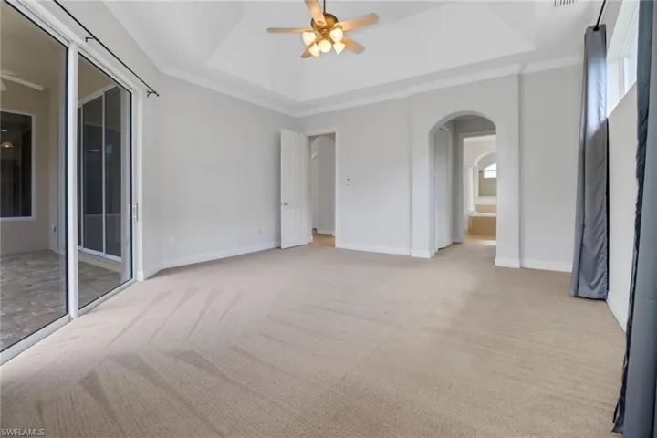 Carpeted main bedroom with 2 large closets
