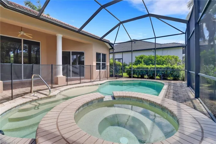 Under cover screened lanai with private swimming pool, spa & view of golf course
