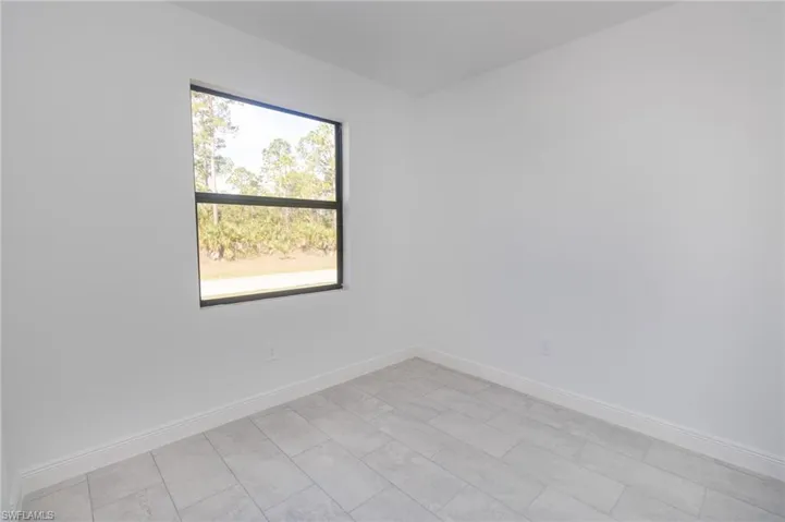 Bedroom featuring tile floors.