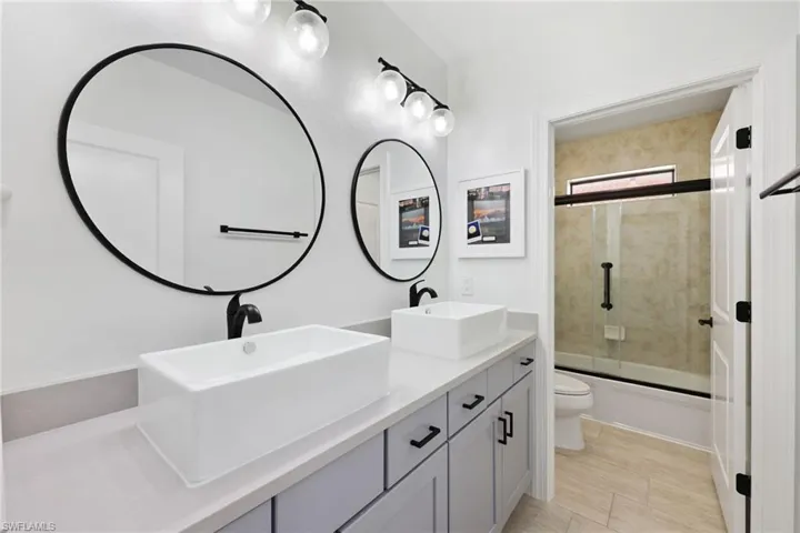 Unfurnished bedroom with a closet, light hardwood / wood-style floors, and ceiling fan
