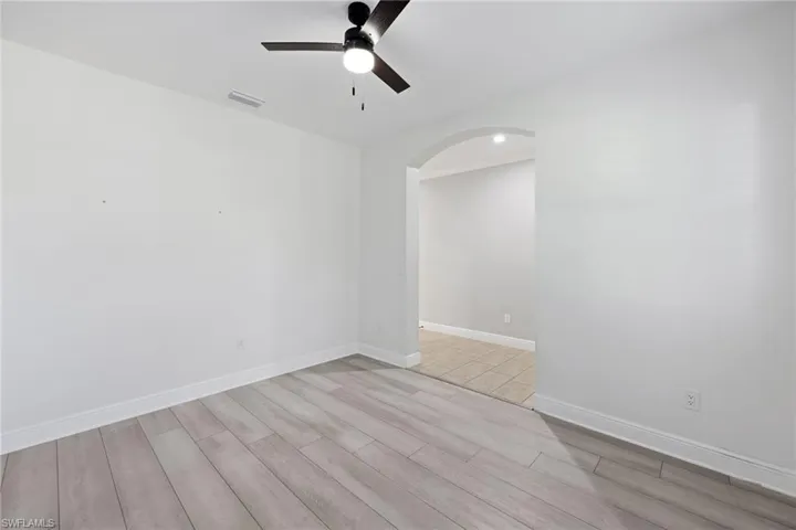 Unfurnished room Office with light wood-type flooring