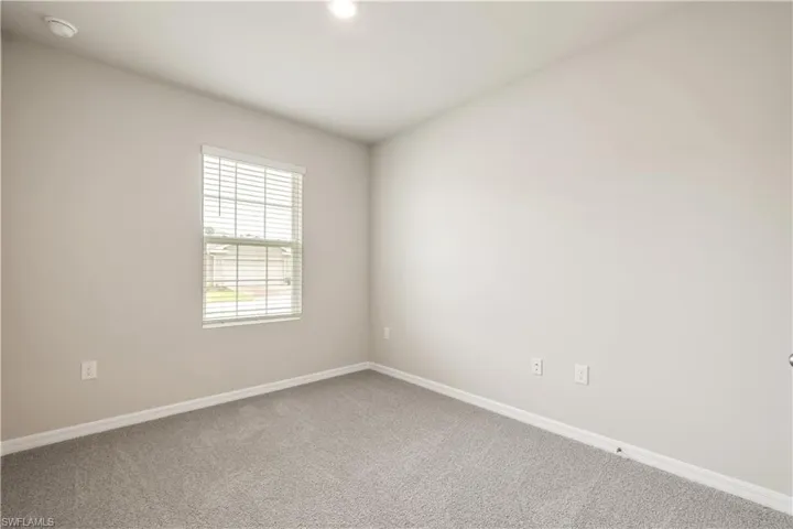 Unfurnished room with carpet