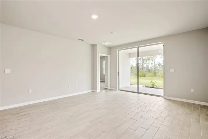 Spare room with light wood-type flooring