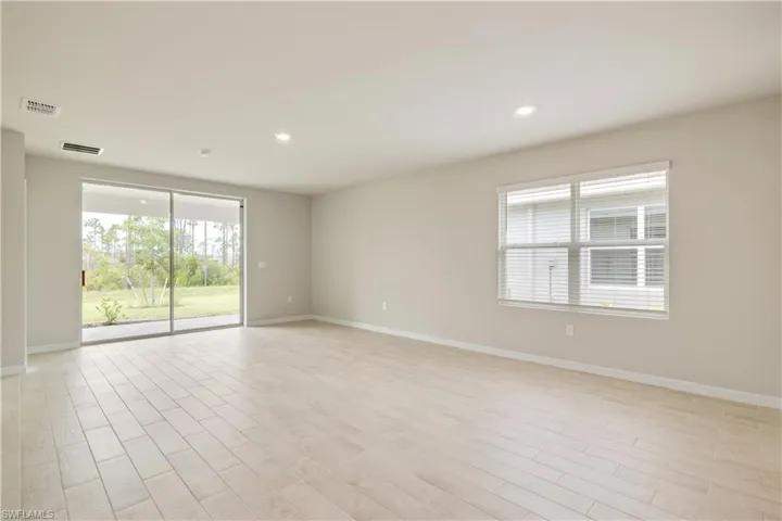 Spare room with light wood-type flooring