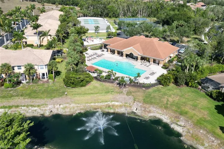 Aerial view of a pool and a large body of water