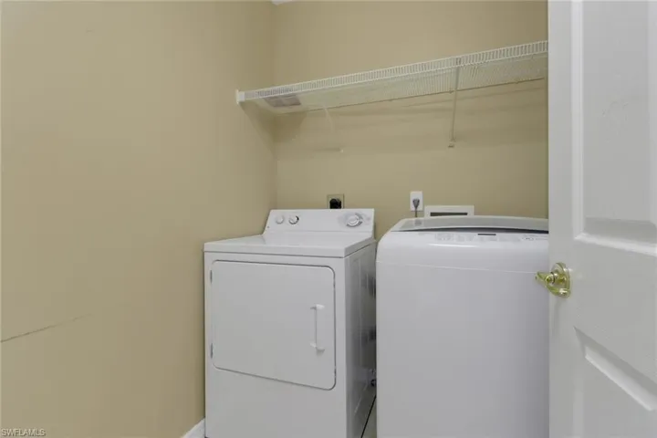 Washroom with washing machine and dryer