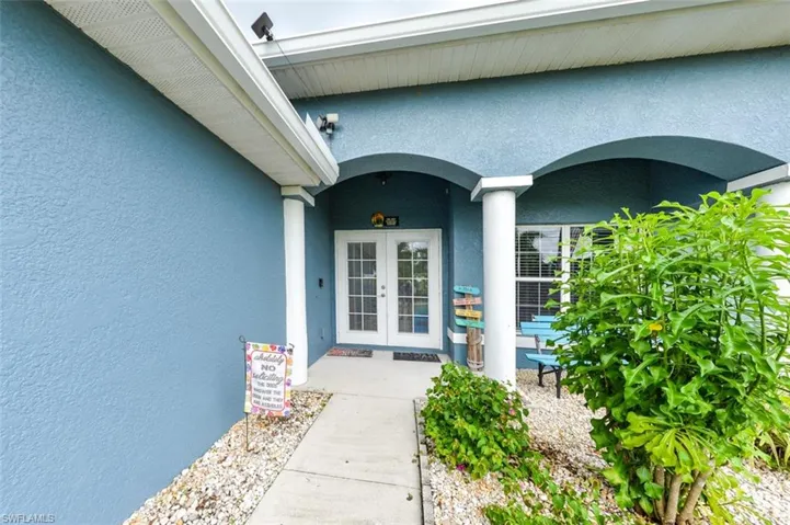 Property entrance featuring french doors