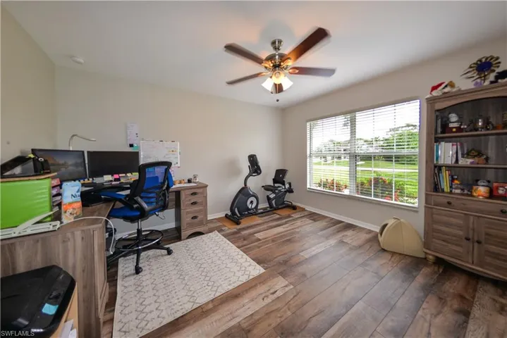 Home office featuring ceiling fan and luxury vinyl wood-style floors