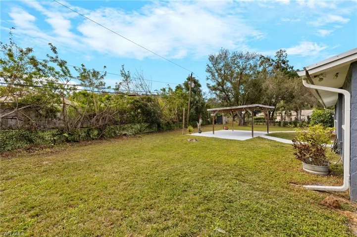 View of yard featuring a patio area and a pergola