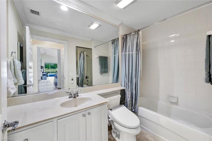 Guest Bathroom has tons of storage and Shower Tub Combo