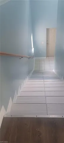 Stairs featuring baseboards