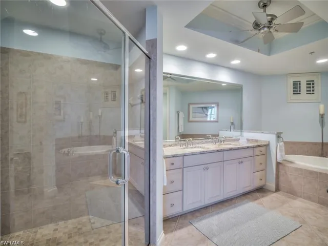 Bathroom featuring vanity, crown molding, tile patterned flooring, ceiling fan, and independent shower and bath