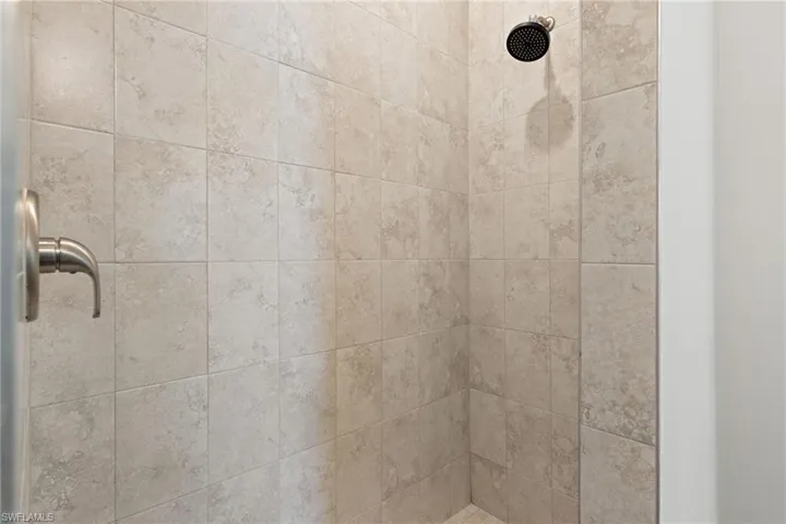Room details with tiled shower