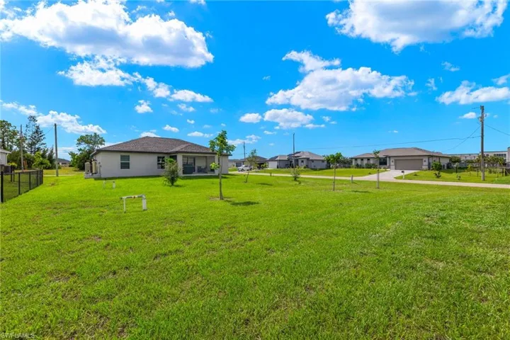 View of yard with a garage