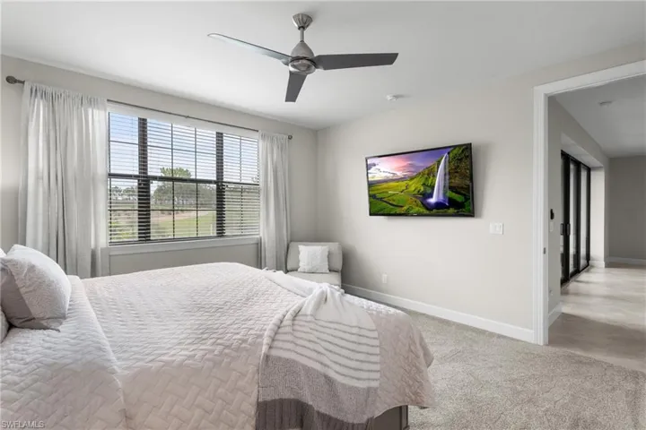 Bedroom featuring baseboards and ceiling fan