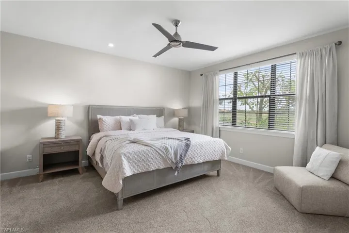 Bedroom with carpet flooring, ceiling fan, and recessed lighting